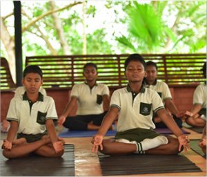 students doing yoga in international school in trivandrum