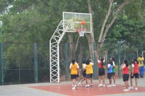 students of international school playing basketball